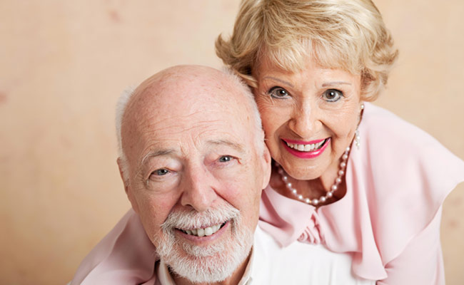 Couple smiling with dentures